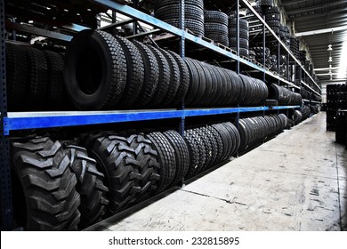 Group of new tires for sale at a tire store - Shutterstock ID 232815895
