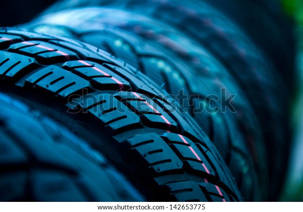 Group of  new tires for sale at a tire store.\
selective focus.