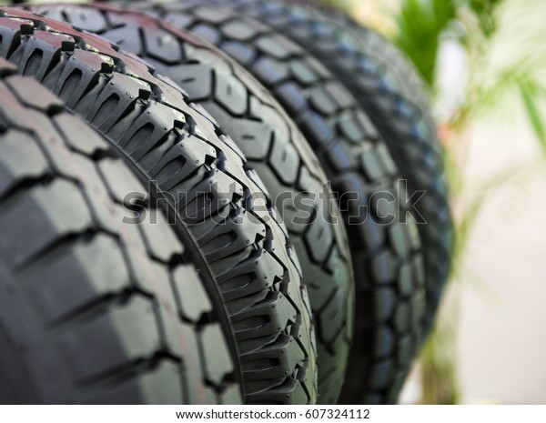 Group of  new tires for sale at a tire store.\
selective focus.