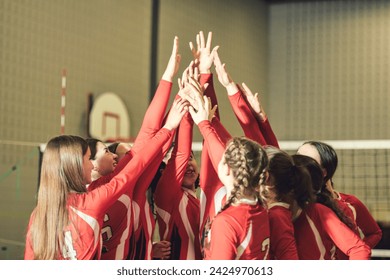 A group of nice teen sport in gymnase play volleyball - Powered by Shutterstock