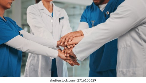Group, nurses and doctors with handstack in hospital for celebration, surgery success and victory. People, healthcare workers and huddle for medical milestone, staff motivation and team achievement
