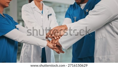 Group, nurses and doctors with handstack in hospital for celebration, surgery success and victory. People, healthcare workers and huddle for medical milestone, staff motivation and team achievement