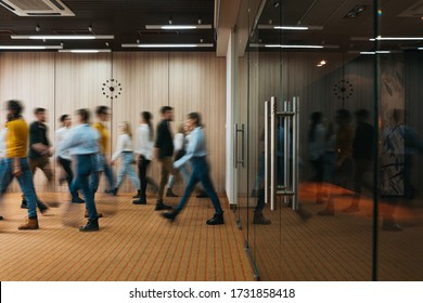 Group Of Office Employees At Coworking Hall. Business People Walking At Modern Open Space. Motion Blur. Concept