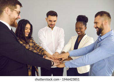 Group Of Office Workers, Colleagues, Teammates, Business Partners And Friends Stacking Hands. Kickoff Meeting, Coaching, Mentoring, Team Training, Beginning New Project, Teamwork, Success Concept