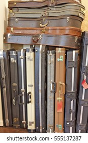 Group Of Old Guitar Case In Music Store