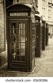 Group Of Old London Phone Cabins Toned In Sepia