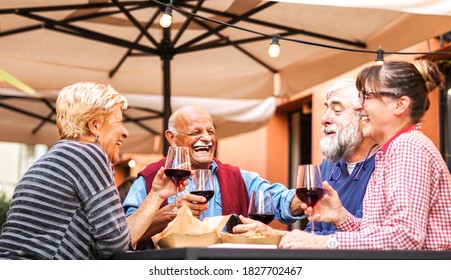 Group Of Old People Eating And Drinking Outdoor 