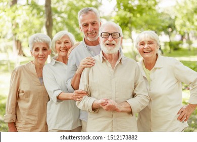 Group Of Old People Looking At Camera And Smiling Stock Photo