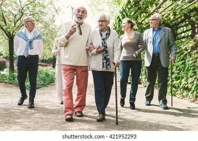 Group of old people walking outdoor