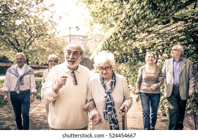 Group Of Old People Walking Outdoor