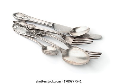 Group of old silver cutlery isolated on white