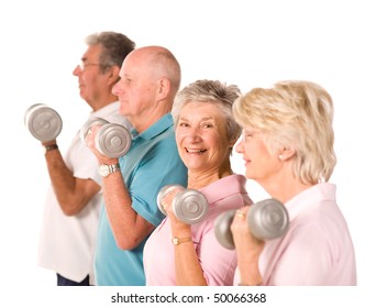 Group Of Older Mature People Lifting Weights In The Gym