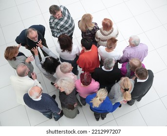 Group Of Older People Looking In The Same Direction.