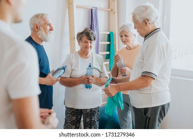 Group Of Older People Meeting At The Gym To Exercise Together