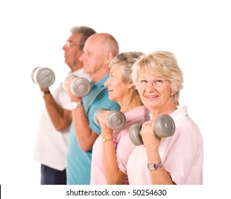 Group Of Older Senior People Lifting Weights In The Gym