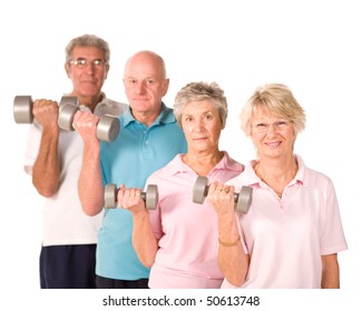 Group Of Older Senior People Lifting Weights In The Gym