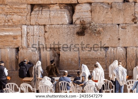 Group of orthodox Jews praying at Western Wall in Old City of Jerusalem, Israel