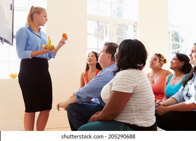 Group Of Overweight People Attending Diet Club