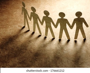 Group Of Paper People Holding Hands. Teamwork Concept