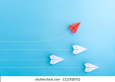 Group of paper plane in one direction and with one individual pointing in the different way. Business concept for new ideas creativity and innovative solution.