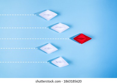 Group of paper ships, red one is the first place,, leadership, individuality concepts. - Shutterstock ID 1863185620