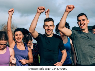 Group of participants ready to start an obstacle course - Powered by Shutterstock
