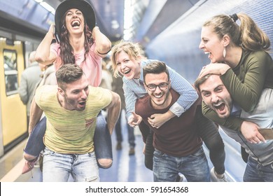 Group Of Party Friends Having Fun In Underground Metropolitan Station - Young People Ready For Night Out  - Friendship And Party Concept - Focus On Center Man Face