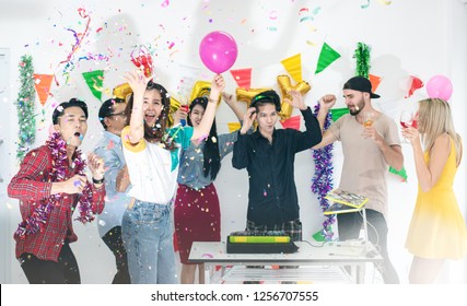 Group Of Party People Enjoy Dance And Jump With EDM Dance Music From DJ In Christmas New Year Party In Event Cheerful Party