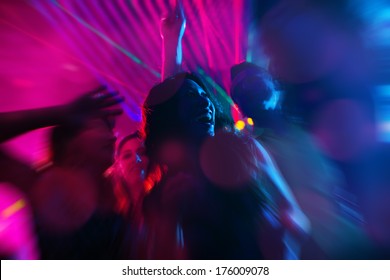 Group Of Party People - Men And Women - Dancing In A Disco Club To The Music