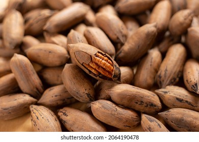 group of pecans shadow wooden background