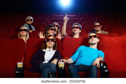 Group Of People In 3D Glasses Watching Movie In Cinema