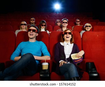 Group Of People In 3D Glasses Watching Movie In Cinema