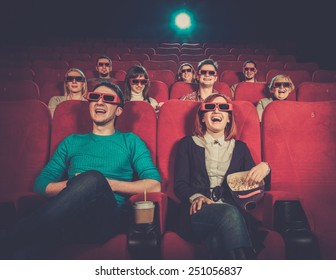 Group Of People In 3D Glasses Watching Movie In Cinema