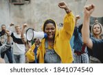 Group of people activists protesting on streets, BLM demonstration and coronavirus concept.