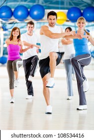 Group Of People In An Aerobics Class At The Gym