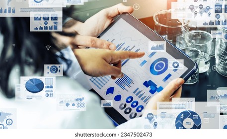 Group of people analyzing data on tablet PC and digital paperwork concept.