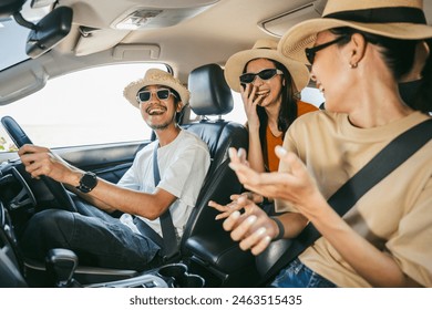 Group of people asian friend man and woman travel by car on a bright day with beautiful blue sky sunlight. They was happy along the way trip. safety driving car vacation on weekend - Powered by Shutterstock