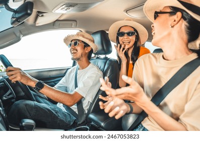 Group of people asian friend man and woman travel by car on a bright day with beautiful blue sky sunlight. They was happy along the way trip. safety driving car vacation on weekend - Powered by Shutterstock