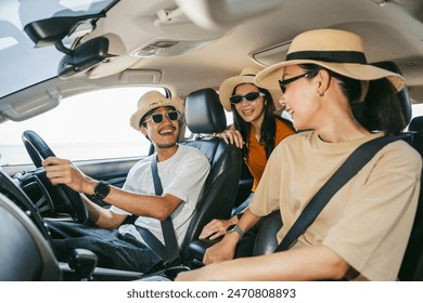 Group of people asian friend man and woman travel by car on a bright day with beautiful blue sky sunlight. They was happy along the way trip. safety driving car vacation on weekend - Powered by Shutterstock