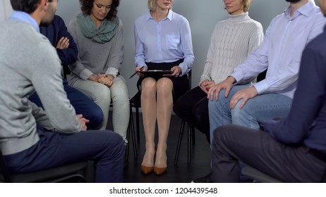 Group of people attending therapy session and talking, psychological support