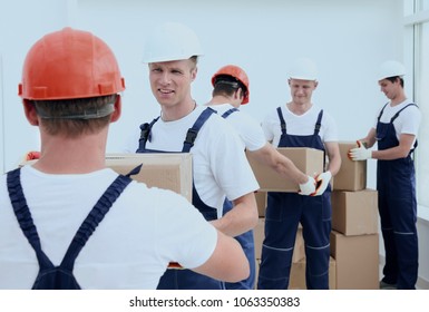 Group of people builders with boxes