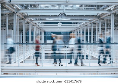 Group of people in business center, blurred image - Shutterstock ID 611417678