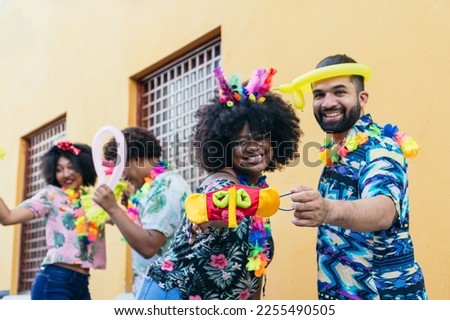 Group of people in Carnival in the streets of Barranquilla, Colombia.
