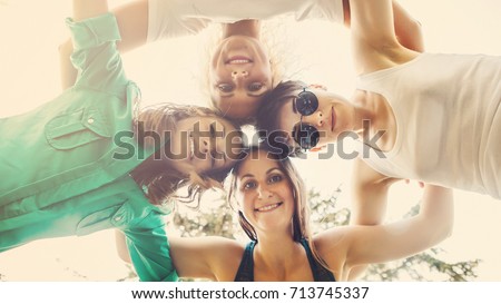 Similar – Young people with their heads together having fun