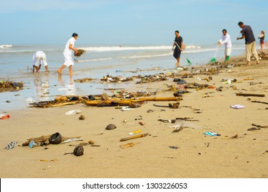  Group Of People Cleaning Up Beach From The Garbage And Plastic Waste.