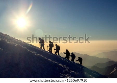 Group of people climbs the mountain Elbrus