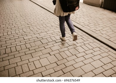 Group of people crossing the street - Shutterstock ID 696376549