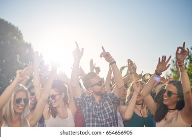 Group Of People Dancing At Outdoor Festival