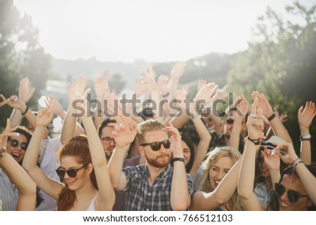 Group of people dancing at outdoor party