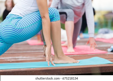 Group Of People Of Different Age Yoga Exercise In The Park At Summer. Big Group Of Adults Woman Doing Yoga Class Outdoor In Nature